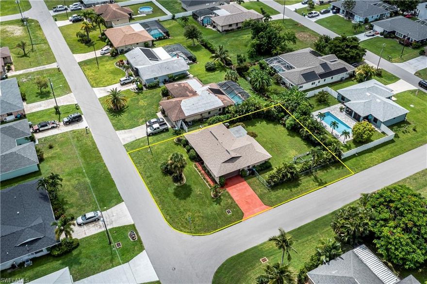 The Perfect Cape Coral Forever Home or Getaway!

Welcome to your new home in Southeast Cape Coral NO FLOOD ZONE! This charming corner property, nestled in a serene neighborhood yet conveniently located near shopping centers and restaurants, offers the perfect blend of tranquility and convenience. Just 2-3 miles from downtown Cape Coral, you'll have easy access to all the vibrant amenities this city has to offer.

Property Features:

Spacious Living: With 1,399 square feet of living space, this home provides ample room for your family to grow and thrive. Featuring 3 bedrooms and 2 bathrooms, the split bedroom layout ensures privacy and comfort for everyone in the household.

Modern Updates: This well-cared-for property has been meticulously updated, including freshly painted walls, updated baths, new window treatments, and a new hot water tank. Enjoy peace of mind with storm protection and a new irrigation system to keep your landscaping lush and green.

Elegant Details: The kitchen boasts beautiful granite countertops, perfect for culinary enthusiasts. The bathrooms have been tastefully updated, adding a touch of luxury to your daily routine.

Outdoor Oasis: Step outside to a beautifully landscaped yard, complete with continuous curbing and a fenced yard for added privacy. The corner lot provides extra space and potential for a pool, ideal for outdoor living and entertaining.

Relaxing Lanai: Unwind in the inviting lanai, the perfect spot to enjoy the breathtaking Florida sunsets. This is Florida living at its best!

Don't miss out on this wonderful opportunity to make this Southeast Cape Coral gem your new home. Experience the ultimate Florida lifestyle in a property that truly has it all. Welcome home!