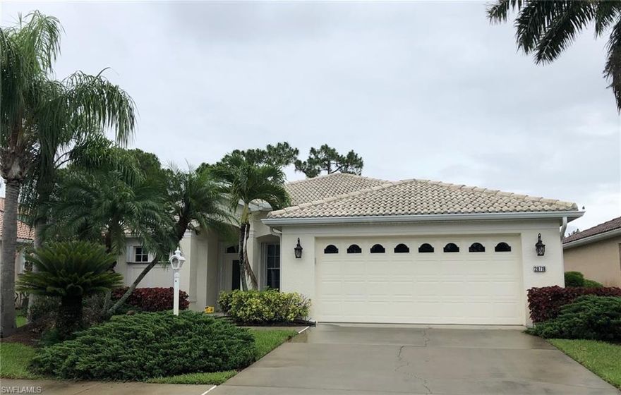 Beautiful Herons Glen Sandpiper home with extended lanai and golf course view.