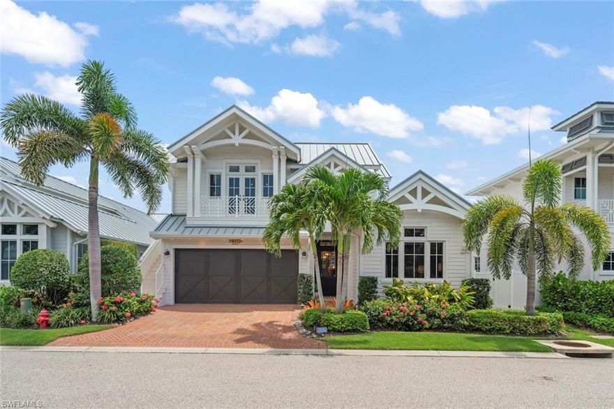 Situated in the sought-after Mangrove Bay neighborhood of Olde Naples, this coastal retreat captures the essence of refined waterfront living. The home offers just over 3,600 square feet of air-conditioned space on a generously sized, southern facing, waterfront lot. The thoughtfully designed Amelia III floor plan includes three en-suite bedrooms in the main residence, complemented by a detached guest suite above the garage—ideal for hosting family or friends. Interiors are elegantly finished with white oak flooring, vaulted tongue-and-groove ceilings, custom Ruffino cabinetry, and rich architectural millwork. The chef’s kitchen is outfitted with Wolf and Sub-Zero appliances, a 48-inch gas range, wine cooler, and a spacious walk-in pantry. Indoor spaces flow seamlessly to the outdoors, where a covered lanai features roll-down screens, a built-in grill, fireplace, and a saltwater pool and spa with a cascading wet wall—all designed for year-round enjoyment and entertaining. A private, deeded boat slip accommodates vessels up to 40 feet and offers a 20,000lb lift, providing direct access to the Gulf of Mexico. Additional upgrades include impact-rated windows and doors, a standing-seam metal roof, tankless water heater, generator, and advanced smart home systems. Located within walking distance to 5th Avenue South, Baker Park, the Gordon River Greenway, and the white-sand beaches of Naples, this residence offers both a vibrant lifestyle and peaceful privacy. The community includes luxury amenities such as a wellness center, concierge services, and a scenic waterfront setting. Meticulously designed and superbly located, this home represents a rare blend of timeless design and modern convenience in one of Naples’ most desirable waterfront settings.