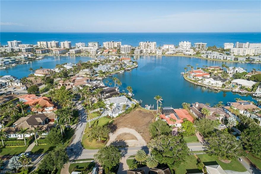Spectacular wide-water views with the ever-popular Naples sunset as the backdrop, this homesite has been cleared and is ready for building your dream home. New dock with 13,000-pound lift installed in 2020 with Gulf access through Doctor's Pass. Conveniently located just minutes to Venetian Village, Moorings Beach Park and all of the shopping and dining opportunities in Old Naples.