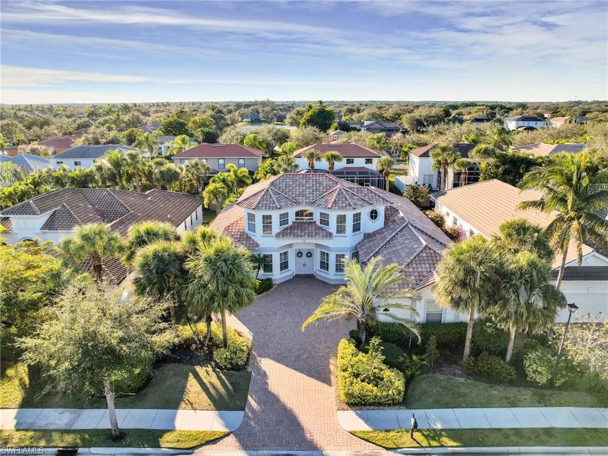 **Significant Price Reduction!** This property is priced to sell quickly. The sellers are motivated as they relocated back to the North due to a change in occupation. This exquisite property was the original builder-spec home within the Indigo Lakes Preserve, featuring unique high-end details and features not found in other Indigo Preserve homes. 

The home features 5 spacious bedrooms, 4.5 elegant bathrooms, and an additional den, perfect for a home office or study. As you step inside, you’ll be captivated by the soaring ceilings and exquisite crown molding that create a warm, inviting atmosphere. The chef-inspired kitchen seamlessly combines style and functionality, making it an ideal space for culinary adventures. The expansive ground-floor master suite boasts a custom walk-in closet and a luxuriously appointed en-suite bathroom, complete with a soothing clawfoot tub and a lavish multi-head walk-through shower. Two additional bedrooms on the first floor share a full bathroom for added convenience. On the second floor, you’ll find a loft-like space alongside two more bedrooms, each with their own bathrooms, ensuring plenty of room for family and guests. Step outside to your private oasis, featuring a custom swimming pool, spa, and an impressive natural rock waterfall—perfect for entertaining or unwinding. Located in a vibrant community with low HOA fees, this home is just a short drive from the beach and within walking distance to excellent shops and restaurants. Don’t miss the chance to experience the perfect blend of luxury and convenience in this spectacular home. Make it yours today!