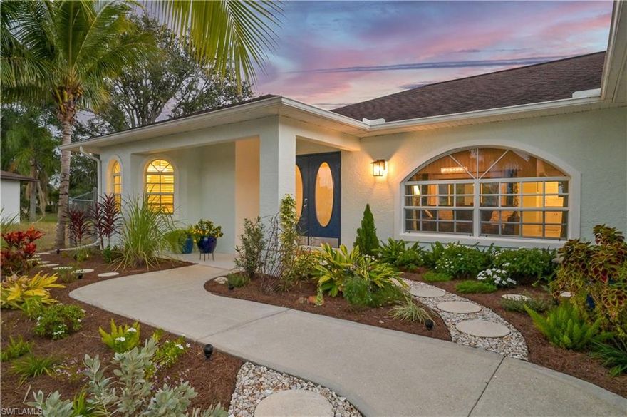 Welcome home to this stunning, fully remodeled 3 bedroom, 2 bath home situated on a truly one-of-a-kind, oversized half acre lot in the heart of sunny SW Cape Coral. This unique property offers space, tranquility, and lush tropical surroundings rarely found in the area. Tall, soaring ceilings create an open and airy atmosphere, filling the home with natural light and enhancing the modern, spacious feel throughout.
Thoughtfully updated from top to bottom, the home features a desirable split bedroom floor plan and contemporary finishes with a move-in-ready design that’s perfect for both everyday living and entertaining. The open layout flows seamlessly between the living, dining, and kitchen areas. The large kitchen offers ample counter space and storage, soft-close cabinets and drawers, and a picture window with panoramic views of over a dozen mature mango trees, along with coconut palms, banana plants, and an orange tree that create a true backyard oasis.
Massive sliding pocket doors open fully to the screened lanai, effortlessly extending the living space and creating the ideal indoor-outdoor lifestyle. The backyard is expansive, fully fenced, and exceptionally private, offering endless possibilities for entertaining, pets, play, or a future pool.
Both bathrooms feature dual vanity sinks. The primary suite is a true retreat, complete with sliding pocket doors to the lanai, a large soaking tub, and a spacious tiled shower. Additional highlights include a separate laundry room off the garage with an oversized washer and dryer, a new hot water heater, no HOA and NO flood insurance required.
Located across from Koza Park and just minutes from shopping, dining, and everyday conveniences, this home offers an exceptional blend of location, lifestyle, and quality. This is a special property that must be seen to be fully appreciated. Schedule your private showing today!