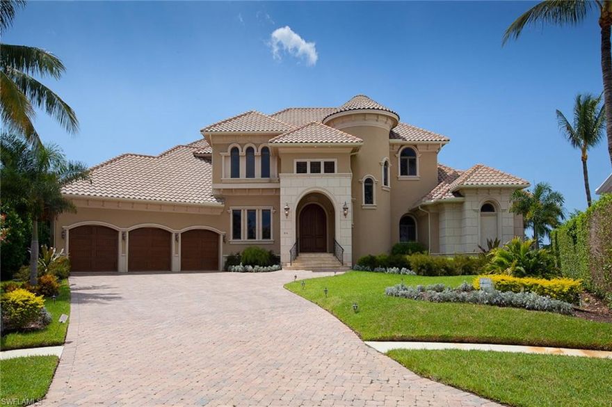 Distinct elegance and meticulous details come together in this beautiful estate home built by Reiman Construction. With expansive panoramic water views this home is perfectly situated on a .59 acre estate lot, with 242 feet of deepwater frontage with direct Gulf of Mexico access. Sold furnished, this 5 bedroom plus den, 5 and 3-half-bath home offers impressive, southwestern exposure with approximately 6508 square feet of living space and 9,880 square feet of total build. A resort style infinity-edge pool and spa, the large outdoor living area with outdoor kitchen and bar are the perfect place to watch sunsets over the water. Boating enthusiasts will enjoy the deep water and quick boat trip out to the gulf. Custom-built in 2010, the home boasts exquisite amenities and fine details throughout. Features include a formal grand salon with floor-to-ceiling windows providing incredible water views, formal dining, gourmet kitchen with top-of-the-line Viking and subzero appliances, breakfast nook, a spacious family room with breathtaking water views and private master suite with French doors opening onto the pool deck, movie theater, guest wing, and much more. This home is a must see.