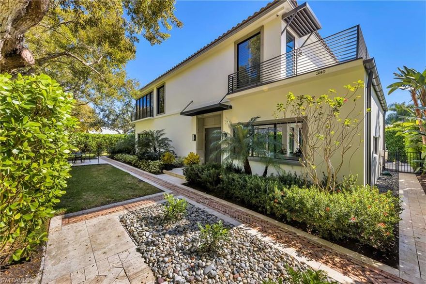 A refined and highly curated private oasis, this expansive, exquisitely appointed 2-story residence is a prime example of the best in custom design. 380 1st Avenue N is situated in a convenient and highly desirable location of Old Naples, just 3 blocks from the beach and 5 blocks from 5th Avenue S. A new massive 16-foot waterfall island finished with quartz and custom cabinetry invite collaboration and entertainment to accommodate today’s modern lifestyle. A recent robust restoration results in a first-floor master bedroom with a custom bath, dual sinks with walk-in shower, and a new powder bath. The living room features a gorgeous fireplace, white beamed ceiling treatment, wide plank wood flooring, and floor to ceiling windows overlooking the resort-like pool and spa boasting southern exposure. The second floor offers a master bedroom, 2 guest rooms with en suite baths, and a large open loft-like space. The custom master bath has been completely transformed with new tile floors, dual vanity, walk-in shower, and floor to ceiling wood shutters. This home is the ultimate in luxury living and just minutes to many restaurants, shopping, and beaches Naples has to offer.