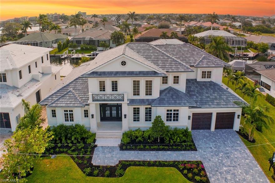 Another magnificent home constructed by The Lykos Group and designed by South Florida Architecture. This home is approximately 5,428 square feet under air and 7,235 square feet total. The home features high-end interior finishes throughout. The stunning kitchen boasts custom cabinetry, appliances by Wolf and Sub-Zero, a large island with Sub-Zero drawers and two dishwashers for an entertainer's dream. This home has a first-floor primary bedroom, five bedrooms, six full baths and one half bath, an elevator to the second-floor great room and four en suites. The outdoor area has a covered entertaining area with an outdoor kitchen and a pool complex with spa. Indoor-outdoor living is seamless with pocket sliders from the great room and sliding doors from kitchen to the outdoor area. Other enhancements include 10-foot-wide white oak wood floors, solid core interior doors, high-end plumbing fixtures, and an audio and visual home system. The home also has an oversized three-car garage and a luxurious landscaping package. With craftsmanship throughout and award-winning design, this immaculately constructed home is an ideal sanctuary. Ready for you to begin your dream of waterfront living.