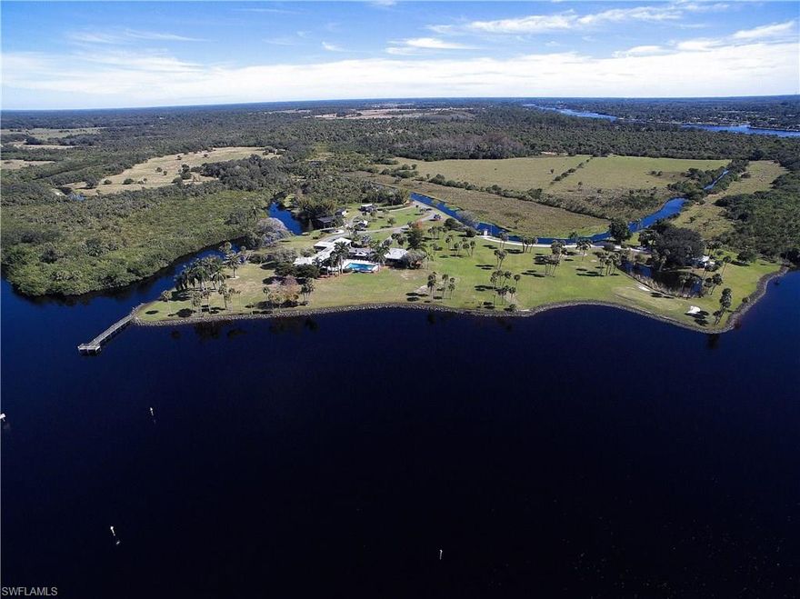 Available for the first time, one of SWFL's best kept secrets awaits you. This luxurious property is nestled on approx 30 acres along the north side of the Caloosahatchee River Intra coastal Waterway. This unique location offers access to the Gulf of Mexico(west coast of Florida) and the Atlantic Ocean (east coast of Florida), and the capability of accommodating a yacht over 100'. Once you arrive you are overcome by the luxurious privacy and breath-taking river views anchored by over 4,000 feet of waterfront. Upon entering this impressive residence a feeling of spaciousness overcomes the senses.  The estate offers 7 bedrooms 6 baths, boat house that offers a slip for a larger vessel and a lift for a smaller boat, 88' dock, 3 equipment sheds, generator and zoysia grass for your very own 3 hole, 6 tee box golf course, and caretakers home with 2 bedrooms.  The open nature of the design creates an environment perfect for entertaining on a grand scale.  Schedule a private showing to experience the best of SWFL's waterfront life. Click on Virtual Tour for a video movie walk through and/or see link http://www.listandtour.com/17891nb.html.