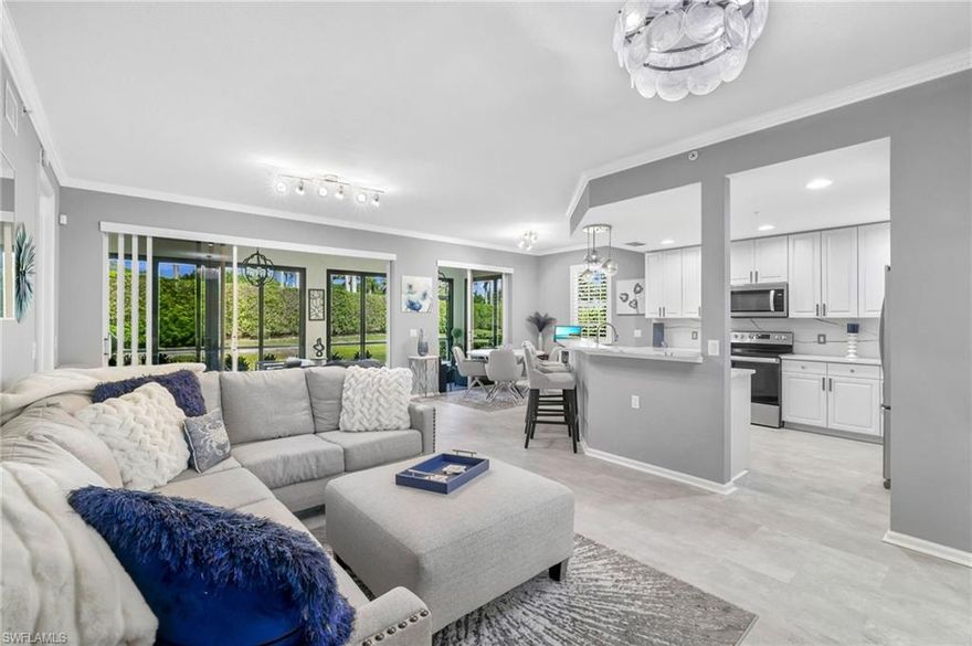 Beautifully updated first-floor residence located within the main gates of Miromar Lakes featuring HURRICANE IMPACT WINDOWS AND IMPACT SLIDERS for added value, style, and peace of mind. This 2BR+den/2BA home offers 1,654 sq. ft. of thoughtfully designed living space with newer luxury vinyl flooring, renovated kitchen with wall removed for an open-concept layout, modernized fixtures, renovated guest bath, newer washer and dryer, and updated lanai screens. The den functions as a 3rd bedroom, offering flexibility for guests or office space. Additional upgrades include motorized power shades on the sliders, Nest thermostat, MyQ smart garage door opener with upgraded locks, and Ring doorbell. Screened lanai allows for year-round enjoyment. Furniture negotiable. Enjoy the award-winning Miromar Lakes lifestyle with 700 acres of freshwater lakes, white-sand beaches, boating, golf, tennis, pickleball, fitness center, spa, and waterfront dining.