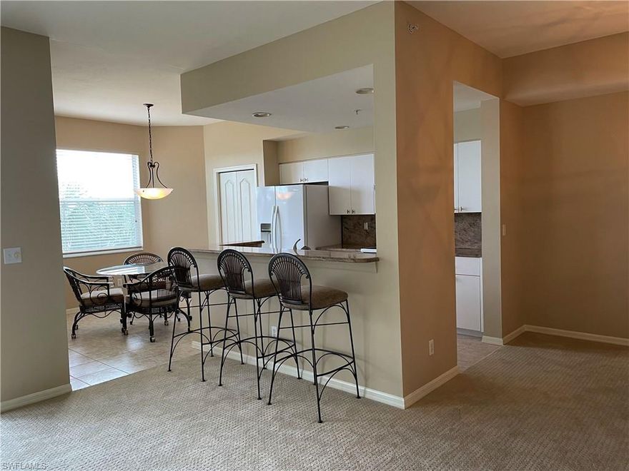 Fresh updates to Heritage Palms condo overlooking golf course, aqua lake and clubhouse. Great views of large aqua lake and southern exposure for light in the living area all day long. New carpet, fresh paint, granite in kitchen make this one move in ready. Brookside floor plan is open to the living area and perfect for entertaining. Lanai is enclosed for cool nights and to keep your lanai perfectly clean. Large storage closet just outside the front door for beach toys, bikes, grill, etc. Heritage Palms is an active community with golf and tennis, restaurants and activities, all at a bundled value.  Just pay cart fees! This location in Fort Myers is convenient to airport, shopping, restaurants and all of our world-famous beaches are close by.