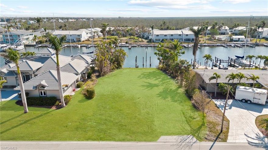 Located in the exclusive Siesta Isles boating community, this waterfront property has boating access and is right before the Matanzas Pass bridge to Fort Myers Beach. The back of the lot over looks a deep water canal leading right out to Pelican Bay, and Fort Myers Beach. This lot is bare with no grass (grass in pictures digitally staged). The property is capable of having boat dock with its deep water canal and with having direct access to the gulf.