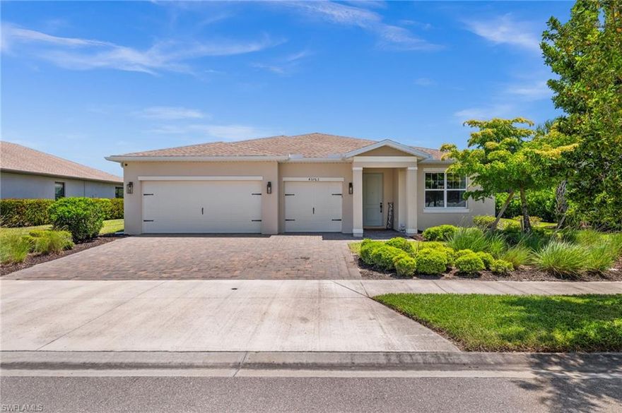 Welcome to 43763 Longleaf Lane in Babcock Ranch, FL!
This is the one everyone's been waiting for. Nestled in Lake Babcock, one of Babcock Ranch's most mature and coveted neighborhoods, this stunning 3-bedroom plus den home delivers the full Florida dream on a premium lake-view lot with a private screened pool, three-car garage, and over 2,100 square feet of thoughtfully upgraded living space. And for qualified veterans, it gets even better: this home is eligible for an assumable VA loan at an extraordinary 2.35% interest rate. In today's market, that is not just a perk, that is a game changer.

Pull up to impeccable curb appeal: a paver driveway, lush tropical landscaping, and clean modern stucco that hints at everything waiting inside. Step through the front door into a bold board-and-batten entryway with dramatic gray paneling that flows into a bright, open-concept layout designed for real life and effortless entertaining. The great room is anchored by oversized tile floors, recessed lighting, and sliding glass doors that frame your pool and lake view like a living painting.

The kitchen will stop you in your tracks. Crisp white shaker cabinets, granite countertops on every surface, a bar-seating island, wall oven and microwave, and a patterned geometric backsplash that adds just the right amount of personality. There's even a dedicated custom built walk-in pantry for the chef who means business.

The flexible den has been converted into a full fourth bedroom with a barn door and wall-mounted closet, while the primary suite serves as a true escape with tray ceilings, pool and lake views, a frameless glass shower, and a custom walk-in closet built out to the nines with shelving, shoe racks, and center drawers.

Then there's the backyard. A covered lanai with ceiling fan and dining set leads to a gorgeous paver pool deck surrounding a sparkling rectangular pool, all enclosed in a screened cage with picture frame screen for unobstructed lake and palm tree views beyond the black aluminum fence. No rear neighbors. Just open sky and Florida vibes.

Babcock Ranch is America's first solar-powered town with trails, top-rated schools, restaurants, and a town center, and Lake Babcock's established streets offer the settled, tree-lined character that newer phases simply cannot match.

This home checks every box and then adds a few more. And if you've served this country, it may just be the most financially powerful move you make all year.