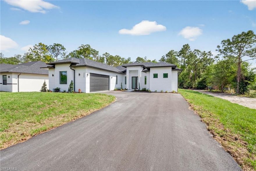 READY TO MOVE IN! Beautiful New Construction Home situated on a 1.59-acre 100% upland lot offering exceptional space, privacy, and flexibility with NO HOA. This property features 4 Bedrooms and 3 Bathrooms, with 1906 Sqft, and plenty of room on the side to bring your car, truck, boat, or recreational vehicles to the back. The oversized fully usable lot also provides the opportunity to build a pool, guest house, workshop, or additional storage structure, making it ideal for buyers seeking future expansion and outdoor living options. Interior features include all tile flooring throughout, hurricane impact windows and doors, stainless steel appliances, quartz countertops, automated sprinkler system, and an asphalt driveway. The primary bedroom includes two large walk-in closets, and the primary bathroom offers dual vanity sinks and a spacious glass-enclosed shower. A 2-car garage adds convenience and storage. Zoned for top-rated schools: Big Cypress Elementary, Cypress Palm Middle, and Palmetto Ridge High. Don’t miss the opportunity to make this exceptional property your dream home.