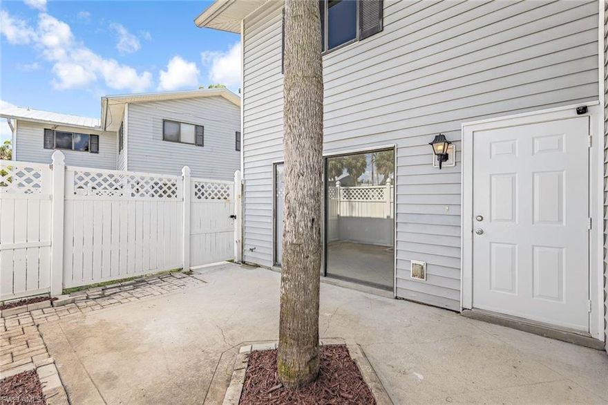 PRICE DROP!!!  Seller is also listing for rent so buyer it before we find a tenant! Motivated Seller! NEW METAL ROOF JUST INSTALLED WITH A 40 YEAR WARRANTY! Come and see this exceptional end-unit townhome with brand new kitchen with granite countertops and a large fenced in courtyard area. The first level offers tile floors throughout the kitchen and living area. New laminate floors just installed upstairs and the everything has a fresh coat of paint. The first floor has a full bath with a new shower and both bathrooms have new vanities and toilets. The 2nd level has both bedrooms with a large walk in closet in the primary bedroom.Water and sewer included in HOA Fee! This pet friendly community offers low HOA fees and excellent central location to everything Fort Myers has to offer.  You will be just minutes away from Downtown Fort Myers and close to great schools, the SWFL International Airport, FGCU, I-75, many popular restaurants and shopping, and the beautiful beaches of Fort Myers Beach & Sanibel. Whether you are looking for a vacation get-away or want to live in paradise year-round, this townhome is a must-see!