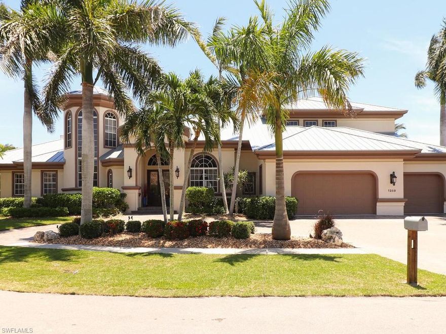 Spectacular views of the Marco River.  Luxurious Larry Taylor custom-built estate is finely furnished and definitely a must-see! Enjoy spectacular Marco River views from this 4 bedroom, 4.5 bathrooms plus den home with a three-car garage and large circular driveway.  Every room has breathtaking water direct views. This property includes a gourmet kitchen with premium appliances, butler's pantry, updated kitchen & backsplash, media room and guest suites upstairs, 120 foot of waterfront with a 14,000 lb boat lift as well as a 7,000 lb kayak/jet ski platform, swimming pool with spa, new outdoor kitchen and a large panoramic view screened lanai that is great for entertaining, new hurricane impact windows and electric roll down hurricane shutters, new metal roof, and fine craftsmanship throughout—too much to list. Make this your vacation home in paradise today.