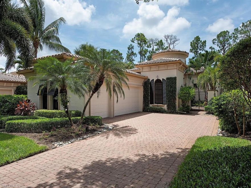 CONTEMPORARY AND UPGRADED. Step into the grand rotunda foyer entry instantly setting the tone for elegance and luxury. Expansive stacking sliders create a focal point and abundant natural light in the exquisite great room. Sensational architectural and designer appointments include volume 12’ ceilings adorned by crown moldings, extensive windows, arched passageways and gorgeous wood flooring throughout the main living areas. The light and bright gourmet kitchen includes stainless steel appliances, white wood cabinetry, gas stovetop, custom backsplash and breakfast bar. The master suite features large his & hers closets, tranquil pool views & direct outdoor access to the covered loggia. Outdoor living and entertaining possibilities are endless in the expansive screened lanai including lounging around the sunlit custom paver deck surrounding the sparkling lagoon pool and raised spill over spa and pool bath. The loggia features an outdoor kitchen complete with a built-in gas grill & work sink. Serene tropical preserve views compose an impeccable backdrop for this tremendous villa that has all the amenities you desire for enjoying the tropical golf course lifestyle in paradise.