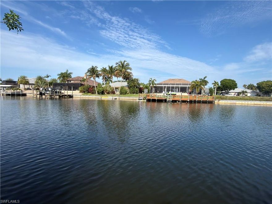 Exceptional western-exposure,150ft+ wide-water Gulf access homesite located in desirable Southwest Cape Coral. This prime lot already features a seawall in place with all city assessments paid, making it ready for your future dream home. Enjoy breathtaking Southwest Florida sunsets from your own backyard while being conveniently close to schools, shopping, dining, and everyday conveniences. Located just approximately 1.5 miles from Sands Park, offering pickleball courts, walking paths, a children’s playground, and additional recreational amenities. Need help getting started? We can also connect you with reputable local builders to help bring your vision to life