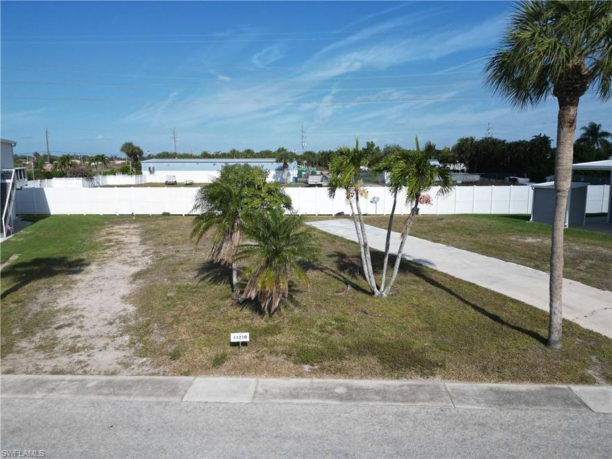 Attention all bargain hunters!!!  If you are looking for an attractively priced lot in a 55+ community that has been cleared and waiting for a new home to be delivered, then this lot is for you.  Conveniently located across the street from the Bayside Estates clubhouse and community pool, this residential lot is the ideal location for the socially minded couple or individual.  It's almost like having a front row seat to all that is happening in this amazing community.  Bayside Estates has experienced a re-birth of sorts since that fateful day in September of 2022.  There are new manufactured homes being delivered almost weekly and others have been repaired and rebuilt better than new.  Several excellent manufactured home builders will work closely with you to get you your dream home whether that be for fulltime living or a winter-time retreat from the frigid cold of the Northern states.  The owner of this lot just happens to work for one such company.  How convenient is that????
Bayside Estates is the best kept secret of Fort Myers Beach. This incredibly active and friendly 55+ community is the crown jewel on the gulf coast. Bayside estates is only 2.5 miles to the beach and is accessible by either car or boat. A very popular activity is riding your electric bicycle to the beach for the day and visit the world-famous Jimmy Buffett’s Margaritaville. Just don't step on a pop-top!!. Nearly all of the major retail vendors are within a very short driving distance for ultimate convenience. For those who don’t know a lot about Bayside Estates, it is a very fun place to call home---some would even say it’s a mature person’s playground. Whether you want to play pickleball, tennis or bocce ball or hang out at the community pool or simply cruise the hood in your swanky golf cart, there is always something going on around here. People are friendly and you will be warmly welcomed.