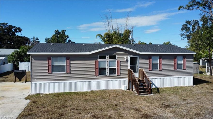 Built in 2018, this well-maintained manufactured home offers comfortable, modern living with a thoughtful layout. Featuring 3 bedrooms plus a den and 2 full baths, the home includes a spacious primary suite with a walk-in closet and an en-suite bath complete with dual sinks and a separate soaking tub and walk-in shower. The open kitchen is equipped with stainless steel appliances and a convenient built-in desk, perfect for work or organization. An interior laundry room with washer and dryer adds everyday convenience. Enjoy the privacy of a fenced yard, ideal for pets or outdoor entertaining. Centrally located near restaurants, downtown Fort Myers, and easy access to I-75, this home offers both comfort and convenience.