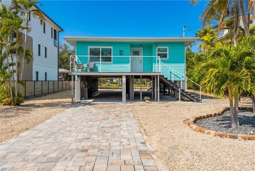 Newly Remodeled Classic Florida Beach Cottage. Perfectly positioned along a Gulf-access canal, this elevated beach cottage offers classic island living at its finest. Just a short, enchanting stroll to the sugar-sand beach, this home blends coastal charm with modern updates, creating an inviting retreat for personal enjoyment or income-producing potential. Recently renovated to perfection, the residence showcases stunning flooring, vibrant coastal tones, and a seamless blend of modern coastal elegance and timeless design. The open-concept living area flows effortlessly into a spacious screened-in balcony, where tranquil water views set the stage for relaxing mornings and breezy evenings. This serene outdoor space connects beautifully to both the main living area and the primary bedroom, offering an ideal indoor-outdoor lifestyle. Recent improvements include a new driveway, along with updated fixtures, lighting, and finishes throughout, complemented by high-end furnishings and new interior window treatments that add a refined finishing touch. Impact-rated windows and sliders installed in 2022 provide peace of mind, durability, and energy efficiency. The property also offers room for a pool, enhancing both lifestyle enjoyment and rental appeal.
Ideally located on a peaceful street with convenient access to the Gulf of Mexico and bay via the backyard canal, this home is perfectly suited for boating enthusiasts, beach lovers, and those seeking a refined island escape. Whether envisioned as a personal sanctuary or an income-producing opportunity, this exceptional property invites you to experience the very best of coastal living.