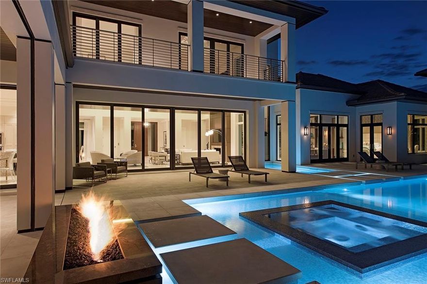 Priced to sell, G.E.S. Construction Limited’s custom estate features clean exterior lines coupled with an open inviting floor plan. The over 7,500 square feet of luxurious living space includes a spacious open great room plan integrating large floor-to-ceiling windows and pocketing sliders allowing ample natural light into the home. The transitional decor, meticulous detail and extraordinary pool with fire/waterfall feature makes this five bedroom, five-and-two-half bath model truly one of Naples most sophisticated contemporary new estates. Additional features include an expansive second-floor lounge, separate VIP suite with living room, club room, outdoor bar and covered loggia with automated screens and shutters, generator and a four-car garage. Located just minutes from world-class dining, shopping and beaches of Old Naples, the award-winning Grey Oaks Country Club has recently completed a multi-million dollar renovation including a 30,000 square foot lavish health and wellness center.