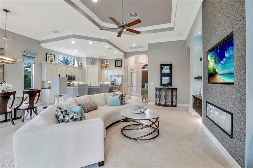 LIKE NEW, FORMER MODEL HOME, professionally furnished and decorated by Pizzazz Interior Designs. This popular San Remo III floor plan by Stock Development is being offered by the original owner, occupied infrequently over 5 years, and meticulously maintained. A 3 bed or 2 +plus den/study, 2 bath BEAUTY with too many features and upgrades to list, addendum with full list available as attachment. Most furnishings and decor are negotiable, THIS IS A MUST SEE TO APPRECIATE! The 2 car garage is sealed and equipped with built in organizers. The backyard oasis offers covered and screened lanai areas including heated pool & spa, and outdoor kitchen with full sliders opening to extend indoor/outdoor living areas. Very private corner lot with professionally landscaped grass, plants, flowers and trees. The home is ideally located at the entrance to the community, within walking distance to golf, restaurant, and exercise as well as quick, easy access to Immokalee Rd. Golf membership to Olde Cypress course are available but not required. Required social membership provides access to fitness center and clubhouse, with no food & beverage minimum. SCHEDULE YOUR SHOWING TODAY, you will be amazed!!!