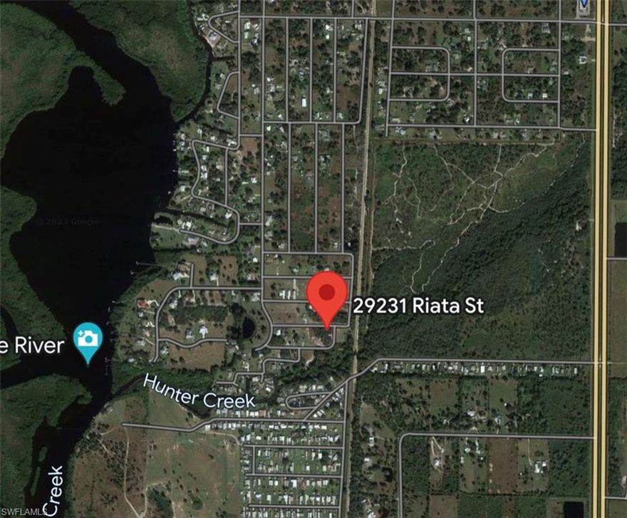 Build your dream house at this great corner lot in Punta Gorda. The lot is near the beautiful Jim Long Lake which you can reach by foot or bicycle. Enjoy the beautiful nature and the wooden view. Come and see where your new life begins.