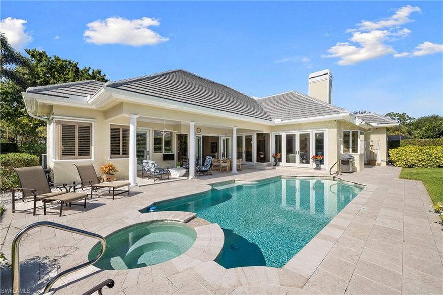 You’ll be enchanted with this beautifully updated and meticulously maintained pool home in popular Pelican Bay. Gorgeous kitchen remodel features a sparkling white marble island, porcelain farmhouse sink, custom wood cabinetry and stainless steel Thermador appliances. The great room boasts wide wood-tile flooring and a stylish stone focus wall with a big screen TV and electric fireplace. Floor-to-ceiling windows and French doors invite you out to the spacious pool and patio with plenty of room for lounging. Volume ceilings and a neutral color palette give this home a fresh, modern appeal. Countless upgrades include a new tile roof in 2020, AC and ductwork in 2015. The south-facing X Zone lot is fully fenced with a mature landscape for absolute privacy and great lawn space - perfect for pets and kids. Fabulous Pelican Bay amenities including two private beach restaurants, miles of pristine beaches, state-of-the-art fitness and tennis make this home a perfect Naples retreat!