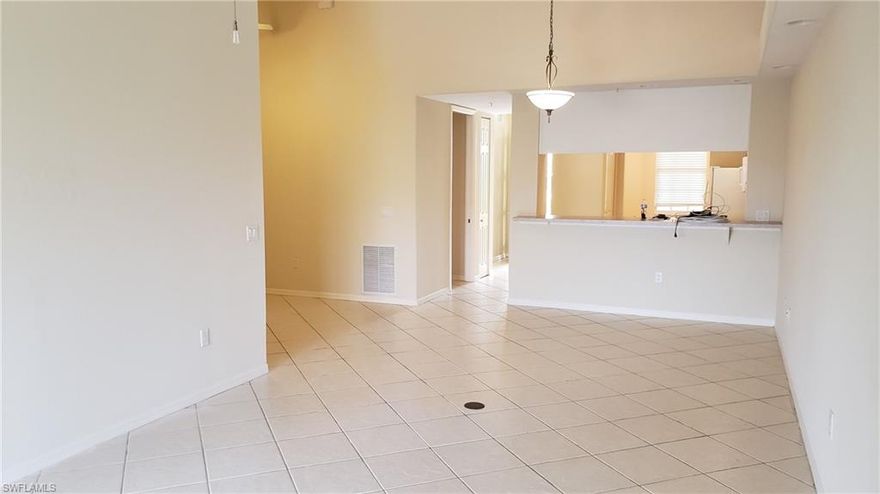 Spacious 2 bedroom, 2 bath, and den condo in pristine condition. This top floor unit is easily accessible by elevator or stairs and has huge soaring vaulted ceilings!  Experience the best kept secret in Cape Coral with Van Loon Commons gated development. You'll love the layout, large great room with a large open kitchen, breakfast nook, breakfast bar/pass through and lots of natural light.   The Dining room area has a large pass-through breakfast bar from the kitchen. The Living Room area has triple sliders that lead to a private tiled & screened lanai. Wood cabinets in the kitchen provide plenty of storage space. The kitchen also has spacious pantry. Adjacent to the kitchen is the Morning Room. A great place to enjoy your morning coffee or casual meal. Small community with lots of amenities and very well maintained and has a lot to offer including a large Clubhouse, scenic walking paths, pool, spa, fitness room, covered parking, storage closet, & much more. Make your appointment today