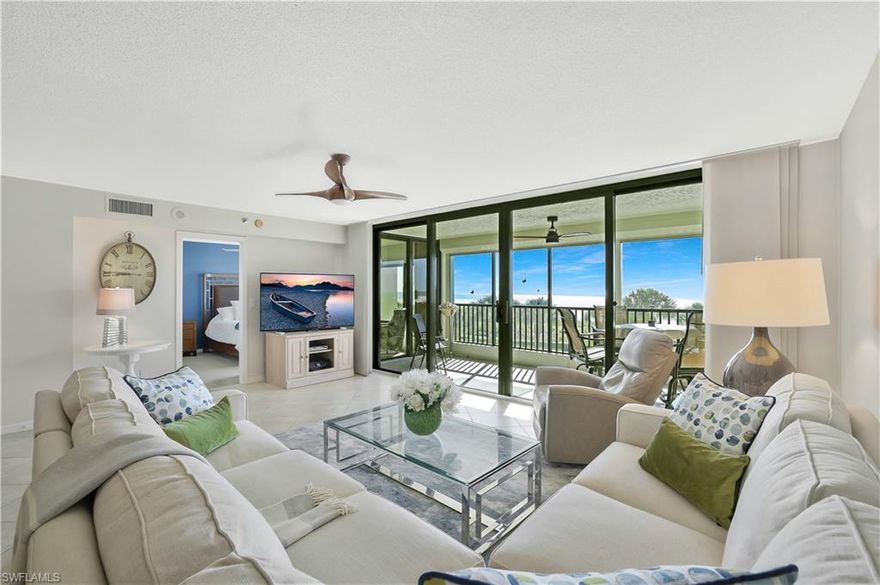 Wake up to full front Gulf of Mexico views and end your days with unforgettable sunsets from the expansive screened lanai of this beautifully updated Gulf-front residence at Crescent Beach. Perfectly positioned in the heart of Marco Island, this desirable location offers close proximity to many of Marco Islands renowned restaurants, while a palm-lined, private drive creates a serene and exclusive arrival experience. Offering 1,450 square feet under air, this two-bedroom, two-bath residence features a rare and highly desirable advantage—elegant tile flooring in the main living area, permitted due to its unique building location. The open, light-filled floor plan is both welcoming and refined. The kitchen has been thoughtfully updated and highlighted by the quartz countertops and backsplash, a pantry, and is ideal for both casual living and entertaining. In-unit laundry and turnkey furnishings complete the move-in-ready convenience. The primary suite is a tranquil retreat with private lanai access and a beautifully remodeled bath featuring double vanities, a spacious walk-in shower, and custom cabinetry. Assigned covered parking and private storage are included and plenty of guest parking. The pride of ownership is immediately felt, showcased through beautiful décor, attractive new light fixtures, crown molding and carefully curated details throughout. Crescent Beach offers private access to Marco Island’s renowned, sugar-sand beach. Community amenities include a resort-style pool and spa, tennis and pickleball courts, shuffleboard, BBQ area, two fitness rooms, an elegant social room with catering kitchen, and an expansive Gulf-front sundeck.