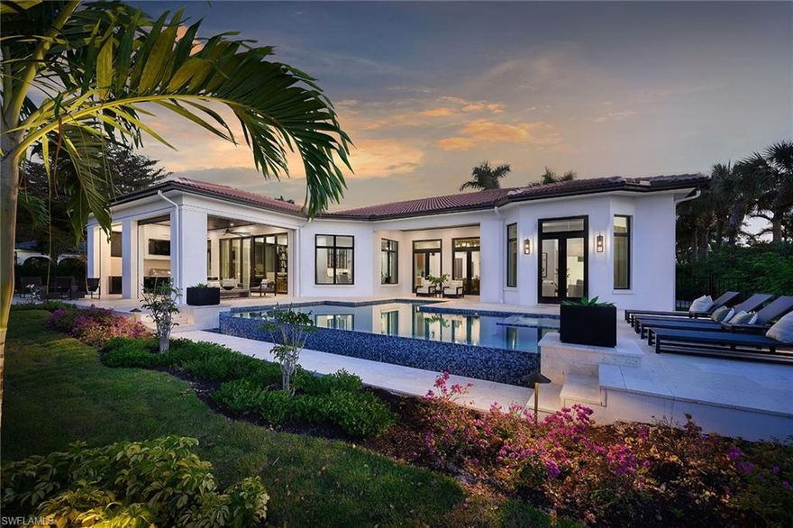 An extensive home renovation to modernize this property was completed in November 2022 by Diamond Custom Homes and Edge Interior Design. Completely transformed inside and out with redesigned architecture that eliminated the overall Tuscany appearance creating clean lines and open concept living. Impact windows and doors, Control 4 home automation, generator, temperature -controlled wine room, and Toto Neorest toilets are only some of the features recently added. Impressive outdoor kitchen and living space including a gas fire pit is ideal for entertaining guests. Relax in the sleek vanishing edge pool and spa overlooking the lake view on the 18th hole on the Palm course. No need to worry about pesky bugs or cane toads with the mosquito misting system and mesh fencing installed to keep you and your pets safe. Winner of the 2023 Sand Dollar Awards for Best Kitchen Design and Best Interior Design for Remodel.