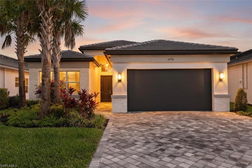 This amazing upgraded Pearl 504 model in Valencia Trails offers quality finishes, a great layout, and a beautiful lake view—all just a short distance to the amenity center. With over $258,000 in builder upgrades, the home is move-in ready.

The kitchen is open and well-designed, featuring GE Profile stainless steel appliances, including a French-door refrigerator, gas cooktop, convection oven/microwave, dishwasher, and beverage center. It also includes quartz countertops and backsplash, upgraded cabinetry with soft-close drawers, a large pantry, and a vented hood. A reverse osmosis system provides filtered drinking water.

Wide-plank engineered hardwood flooring runs through the main living areas, den, and primary bedroom. The primary bath includes a soaking tub, frameless glass shower, and dual sinks. The guest bathrooms are also nicely finished with upgraded tile and fixtures.

The outdoor area features a custom heated spool (pool and spa combination) with built-in seating, jets, lighting, and a full screen enclosure. It’s perfectly positioned to enjoy the peaceful lake view and is especially nice to use in the evenings when the community amenities are closed.

Additional features include impact windows and doors, solid-core interior doors, an extended 2-car garage, a paver driveway, a Tesla charging station, a water softener, and wiring for modern technology.

Valencia Trails is a 55+ community with a clubhouse, pools, fitness center, tennis and pickleball courts, restaurant, and a full calendar of activities. It’s conveniently located near shopping, dining, and the beaches.