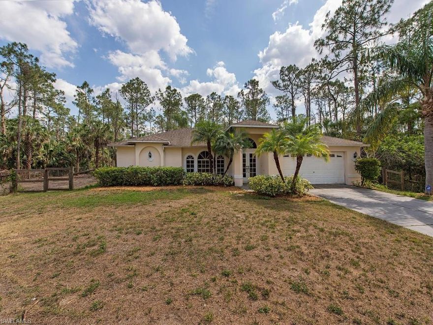 This is a super 3 bedroom, 2 bathroom home is located on a private lot with no visible neighbors.  The front french doors greet you, and from the foyer you have a complete view of the living room, lanai and large back yard complete with patio and fire pit!  The back yard is fenced from the house to the side lot lines, but there is more land behind the fence that can also be utilized.  The front yard has a lovely, winding driveway through the pine trees.  The bedroom flooring is currently bare concrete awaiting awaiting your new flooring choice.  Kitchen is an open plan with a full length bar that is great for entertaining. There is a screened lanai under truss as well as a large open patio area giving this property a ton of outdoor living space.