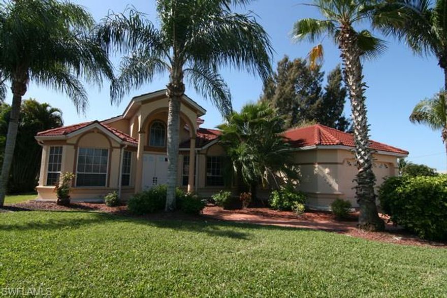 Great opportunity to own a house on a canal with Gulf access! Well maintained Tudor Home in quiet SW Cape Coral neighborhood with open floor plan on 200 ft wide Marabella Canal. House is offered turnkey, so ready for move in. New A/C in 2013, 3 BR and 2 bath, all new carpet in living and bedrooms, new living room furniture. Wide sliding doors from living room and guest bedroom and french doors from Master bedroom give entry to the large covered lanai with stamped concrete floor, nice electric and solar heated pool and whirlpool. Enjoy the unbeatable southern view on extra wide canal, that gives the feeling to live on a lake. Put your lounges on the large wooden dock and enjoy the sun. House was used as a seasonal rental. Schedule your showing today, before it's too late!
