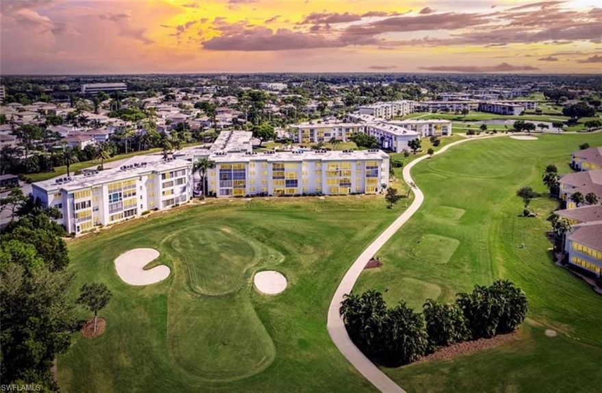 SEVEN LAKES: GOLF COURSE VIEWS & ALL-INCLUSIVE RESORT LIVING! Trade your snow shovel for a golf cart! This beautifully updated 2-bedroom, 2-bathroom condo in highly sought-after Seven Lakes offers the definitive, low-stress Southwest Florida lifestyle for seasonal residents or year round if you choose. Step inside a light-filled space featuring a Modern Traditional style, complete with real hardwood flooring, elegant granite countertops, and freshly painted walls. The spacious layout is designed for comfort and ease. The true highlight is the view: enjoy breathtaking, panoramic views of the executive golf course from your private Lani. This is more than a view, it's a value—unlimited golf is included in your HOA fee! The $103 monthly HOA delivers an unparalleled, all-inclusive lifestyle: One of the 6 heated pools is just steps from the front door of this unit! Enjoy tennis courts, pickleball, shuffleboard, a dog park, bingo, bus trips, and more, all covered (excluding electricity).For maximum convenience, a dedicated CAR PORT PARKING SPACE and a GOLF CART PARKING SPACE are INCLUDED IN THE LIST PRICE. Pet-friendly (up to 25 lbs).Don't miss the chance to own a piece of this vibrant, resort community. Come experience the lifestyle that most only dream of!