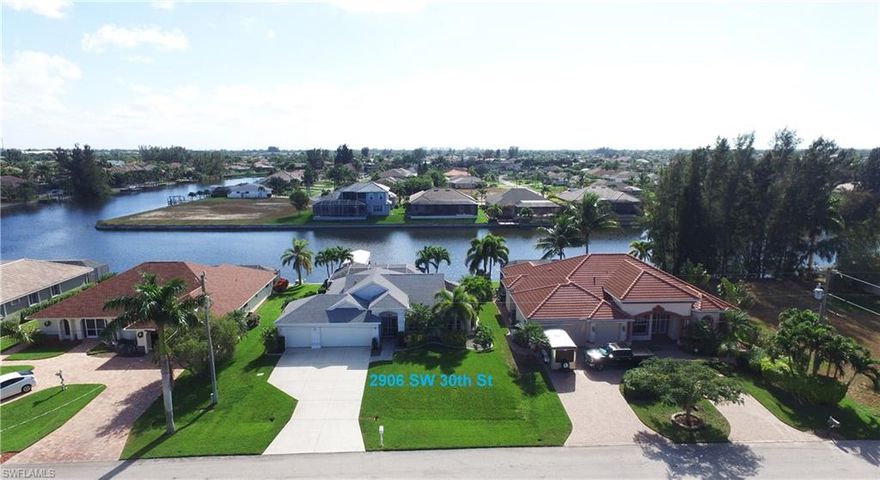 UNBELIEVABLE FIND OFF SURFSIDE! Your Florida Waterfront Dream Home Come True! Beautiful Gulf Access, 3 Bedroom 1 owner home, with a dream 3 Car Garage located on the most beautiful 200’ wide saltwater canals, amazing waterfront views! Why not have it all? There are so many features in this open concept entertaining floor plan pristine home, you will be amazed! Some to include a gorgeous solar & gas heated pool & spa, large lanai, pavers sun deck, private boat dock w/ boat lift & canopy, water & electric at dock, whole house generator, an updated kitchen w/granite counters, premium appliances, even a French Door Refrigerator & GE Profile Gas Double Oven Stove + gas, water, and cable hook-up w/wired speakers for your flat screen TV & stereo on the lanai! Enjoy beautiful newer bathrooms, granite counters, electric hurricane shutters on front door and full lanai + accordion shutters on other windows & new impact garage doors in 2015! New 2014 A/C, a surge protector on main electric panel, security system, city utility assessments paid in full! Call today to view for a private showing or for any addit'l information, don’t miss out. Features, survey/elevation/wind mit/reports  attached.