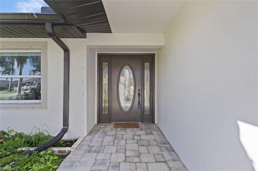 Welcome to your fully renovated waterfront retreat in the heart of Cape Coral. Located at 2232 SE 27th St, this stunning 3-bedroom, 3-bathroom home was thoughtfully redesigned in 2021 to blend modern elegance with everyday comfort.

Step inside to an open-concept floor plan featuring beautiful porcelain wood-look tile throughout and sleek quartz countertops that elevate every space. The living area is enhanced with designer lighting from West Elm, creating a warm, high-end ambiance from the moment you walk in.

This home offers a rare and functional layout, including a private en-suite bathroom in Bedroom 2—perfect for guests or multigenerational living. The primary suite is a true retreat, complete with custom California Closets designed to maximize both style and organization.

The attention to detail continues beyond the main living areas, with a dedicated air-conditioned storage room—an added convenience you didn’t know you needed.

Step outside and embrace the Florida lifestyle. The newly built heated pool (2021) provide the perfect setting to relax or entertain. Enjoy outdoor gatherings under the pergola, and take advantage of your private boat lift with direct access—just one canal away—from the Caloosahatchee River. During our cold months, enjoy your time making smores with family and friends the designated fire pit area.

Whether you’re looking for a primary residence, vacation home, or investment property, this home delivers. With a proven track record as a successful Airbnb rental, it offers both lifestyle and income potential.

This is more than a home—it’s a carefully curated living experience where every detail has been considered. You won’t want to miss this!!!