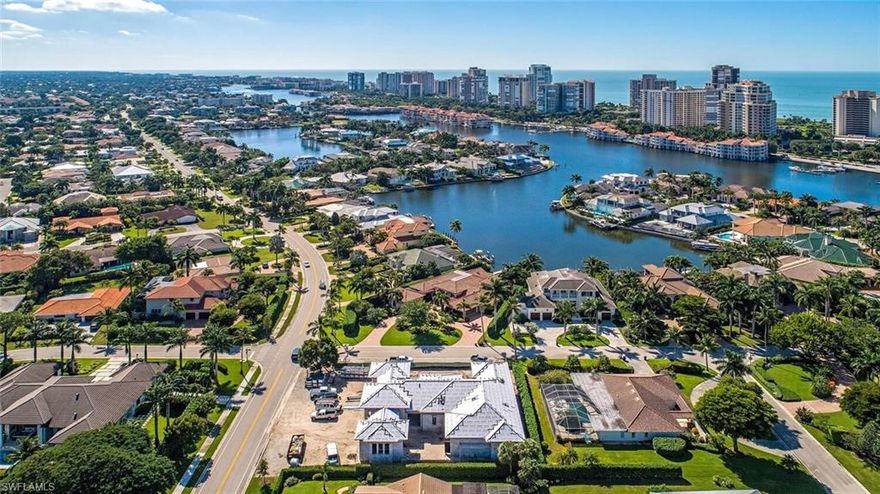 New construction opportunity west of Crayton Road in Park Shore offering superb location, quality, and finishes. Knauf Koenig, Falcon design, and Calusa Bay have come together to create a very special one level home featuring 5 bedrooms, 5 baths, a 3 car garage, and a resort like outdoor living space offering southern exposure.  Filled with the best of the best finishes including Legno Bastone Lancaster oak wood flooring, Sub Zero, Wolf, and Asko appliances, extensive custom millwork, and a generous open plan ideal for entertaining.