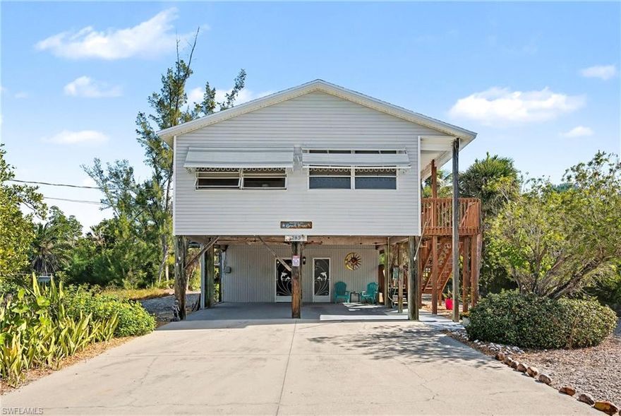 Elevated beach house with pool and pool cage on 1/4 acre lot.  Screened in pool cage.  Easy Access to Fort Myers Beach.  Home is priced below current appraisal.