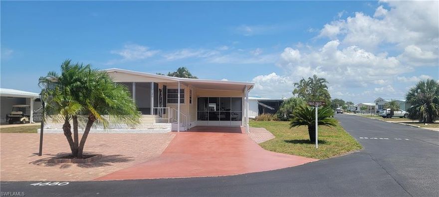 Very well maintained Home on owned land in a Gulf Access Community! Two bedrooms, two baths, open floor plan, white cabinets in the kitchen with a breakfast bar, corner kitchen sink & windows with plenty of natural light. The Florida room faces south for those sunny relaxing days! A/C unit new in 2022, good roof has regular inspections and service, 5 year old hot water heater, new washer & dryer. Newly installed pavers for plenty of parking and little maintenance care. The active clubhouse has planned activities, pool, hot tub/spa, tennis, pickle ball, shuffleboard, boccie ball, picnic area. The lake at the park shows off colorful tropical sunsets and is a favorite place for residents to gather. The community proudly presents Gulf access into Estero Bay then into the Gulf in minutes by way of the private boat ramp for all residents to use. Once on the water there is fishing, shelling, beaches, waterfront restaurants and watching dolphins, and sunsets before getting home in minutes! Spring Creek Village has a convenient location and very low HOA Fees!!!! Coconut Point Mall and the new Lee Health at Coconut Point are just minutes away. The Hertz Sports arena, restaurants, shopping, public golf courses, FGCU, Fort Myers International Airport are all close by.