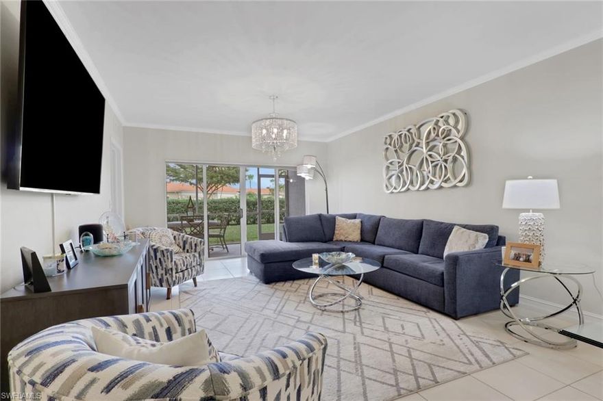 This impeccably maintained first-floor, 3-bedroom condo is being sold TURNKEY!! This open-concept condo has 1431 Sq. Ft. and feels spacious and airy from the moment you enter. There is a large kitchen with option for an eat-in breakfast area and a large pantry. The light-bright kitchen has ample counter/cupboard space with white cabinetry and stainless-steel appliances which are only 3 years old. The spacious primary bedroom has a double sink vanity, large walk-in-closet, and ensuite bath. There is a guest bedroom and guest bath as well as a third bedroom that could be utilized for an office or den. There is elegant crown molding throughout, and the entire condo has recently been painted. There is abundant light throughout this end-unit with the extra windows!  Nestled in a quiet neighborhood, Blue Heron offers beautiful grounds, a sparkling community pool and clubhouse, as well as a plethora of social activities. The low condo fees in Blue Heron covers cable, water and so much more. The condo association painted the exterior of all buildings and replaced the roofs in 2023. Both annual and seasonal rentals are allowed, making this a great investment property. Blue Heron is conveniently located one mile from Berkshire Commons with dining, shopping, grocery stores and banking. It is a short drive to downtown Naples and the white sand beaches, fine dining, shopping and golf.