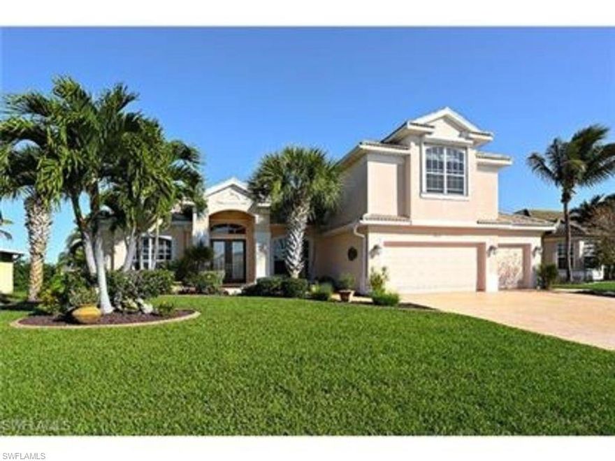 Spectacular, Beautiful, spacious Gulf-Access Pool home in desirable Surfside neighborhood. This 5 bedroom room and 3 bath home will give you the resort life style you are looking for in SW Florida. This home features an open floor plan with kitchen in the center designed to entertain your family and guests even while you are preparing meals. Updated Kitchen has Granite counter tops, stainless steel appliances and plenty of cabinet space. Formal Dining area features elegant decor including coffered ceilings, crown molding and accent walls. Enjoy views of your designer's pool and wide canal from throughout the house. Master bedroom has his/her walk in closets, In suite bathroom w/dual sinks, Roman tub and separate shower, the second floor is a huge studio or bonus room which can be used in several ways such as bedroom, arts & craft studio, in-law suite, media room or private “Man cave” to name a few options. Dual zoned A/C units. Pool area has a wet bar and over-sized BBQ grill. 3 car garage. Last but not least enjoy fishing from your own private dock which includes a 10,000 lbs boat lift and includes a captain's walk and fish cleaning station. Furniture is optional.