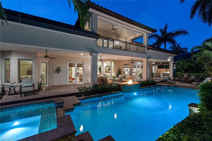 Timeless elegance awaits as you approach this beautiful Moorings residence situated on an oversized lot on one of the most coveted streets in the neighborhood. This two-story home features four bedrooms with four en-suite baths, a den (or 5th bedroom), an office, two additional half-baths and an elevator. The home’s layout flows beautifully and showcases its many wonderful spaces, such as its split four-car garage, grand first-floor owner’s suite, formal dining and living areas, a large great room and a kitchen area, perfect for gathering. The home is adorned with elegant finishes throughout, such as marble and hardwood flooring, granite and marble countertops, solid wood cabinetry and professional-grade appliances featuring a Viking six-burner gas range. The outdoor spaces are just as impressive with a large sparkling pool and spa, fire pit, full summer kitchen and expansive covered lanai with numerous places to relax or entertain. The second floor features an additional covered lanai overlooking the pool and a large sunset deck perfect for those famed Naples evenings. This home has been lovingly cared for and is ready for its new owner to begin living the Naples lifestyle.