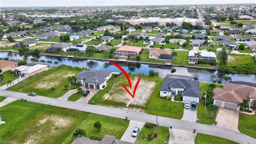 This canal front lot is surrounded by beautiful homes and is ready for YOUR perfect home to be built. Located just off of Veterans Pkwy, you would be minutes away from shopping and restaurants. Everything you need is nearby! 18 miles to Fort Myers Beach.
