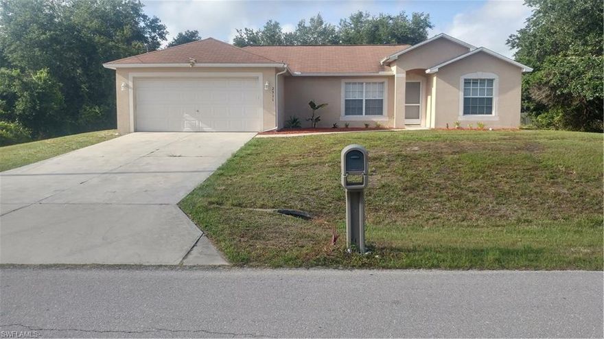 Lovely 3/2/2 home in Lehigh Acres, Florida. Consisting of 1,375 sf of living area with new paint, new carpet, new water filter system and newer air handler.  Enjoy features like the reverse osmosis under sink filter, screened Lanai, Bay window in dining space and a finished 2-car garage with newer opener. There's convenient ceiling fans with lights in bedrooms and living room to help keep you cool. The right size house, the right size yard and the right price; make this your home today.