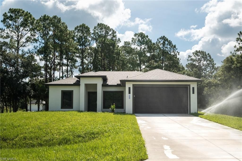 Photo of 135 McArthur BLVD, LEHIGH ACRES, FL 33974 (MLS # 226023587)