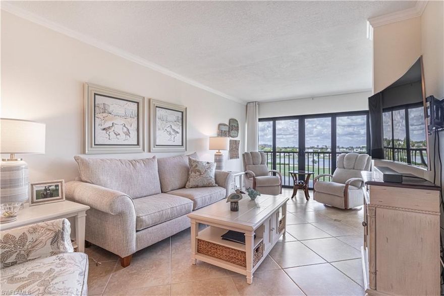 Welcome to Seven Lakes Golf and Tennis Community!!  This top floor 2 bedroom 2 bathroom condo is meticulous maintained.  Has many updates too.  Kitchen has been remodeled with newer cabinets, granite countertops and stainless steel appliances.  Bathrooms have updated vanities and walk-in showers.  Tile floorings throughout laid in a diagonal, and no popcorn ceiling in this unit.   Primary Bedroom has an ensuite bathroom and has a gorgeous view of 3 lakes and the golf course.  Guest Bedroom has a murphy bed for your guest.  All windows are impact resistant.  CAR PORT SPACE AND GOLF CART SPACE INCLUDED.  This is a 55+ Gated Community and is located with restaurants and shops all around. All amenities are included in your condo fee which includes an Executive 18-hole Golf Course, with no additional fees for 2 owners per unit to play as you Desire. Putting Green, Driving Range. 6 Tennis Courts, Pickleball, Bocce Ball or Shuffleboard. Many Cards and Game Groups, Planned lifestyle events and outings. Live Music events and Entertainment brought in for you and your guests. "Tee Room" Restaurant/Bar, Great Neighbors and Social Support.  Your Condo fees also cover your internet/cable, water, sewer, trash removal, lawn maintenance, you pay your electricity. Great fun, friendly community you will love all that Seven Lakes has to offer come and take a look at this lovely condo.