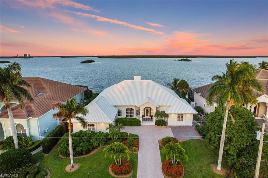 This luxurious 4-bed, 3-bath haven is nested on a quiet cul-de-sac street and offers a lifestyle beyond compare.  As you step through the elegant front door, you will be greeted with the rare, unobstructed, wide open water views and you will fall in love with this meticulously updated home.

Imagine waking up to the gentle sounds of dolphins playing in the open waters and the soft hues of a breathtaking sunrise. As you sip your morning coffee, take in the unobstructed panoramic water views throughout this home that will transport you to a world of serene beauty.  

Your new boat lift and dock are ready for aquatic excursions, with direct gulf access. With great fishing and a highly sought after boating location at your doorstep, adventure is always at hand.  Relax in your private pool and spa or host unforgettable gatherings in your spacious screened lanai, complete with covered seating area and built-in grill.

Convenience is key, and this high-end neighborhood is just minutes from pristine beaches, shopping, and dining. This is the life you’ve been dreaming of – a luxurious retreat where every day is filled with beauty, adventure, and relaxation.