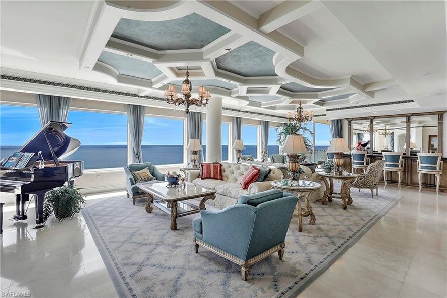 Over $1 Million Dollar price reduction!  Timeless Elegance awaits you in this 23rd floor Penthouse on the Gulf of Mexico!  A true Architectural Masterpiece boasting 7,165 SF of unsurpassed quality and wood craftsmanship throughout!  Southwest exposure with unequivocal Gulf of Mexico views from every room!  Over 1,100 SF of outdoor living space with 4 private terraces and balconies to enjoy endless, unobstructed, breathtaking Sunrises and Sunsets!  Perfection at its finest with 5 beds/5.2 baths, marble floors, personalized Holly Fields artwork, floor to ceiling glass windows, wine cellar, Grand Salon Bar and Great Room with hidden television, grandeur dining room perfect for relaxation or entertaining!  Open gourmet kitchen boasts gas range, and double ovens open to eat in breakfast room and family room with fireplace. Incredible Master Suite with views all the way around, complete with sauna!  This residence will "Wow" you from the moment you walk in, a chance to own a legacy property on Marco Island.  The resort style residence with award-winning amenities will add to the opulence of this incredible property!  Being sold turnkey furnished complete with private A/C 2 car garage