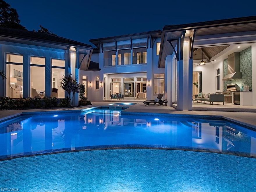 This home is a MUST SEE!  Located on one of the most beautiful streets in Park Shore this captivating residence situated on Venetian Bay and in close proximity to the beach is a rare opportunity. The spectacular light-filled four-bedroom-plus-study, six-bath home with high ceilings flows gracefully from one engaging space to another. The kitchen with oversized island offers Ruffino cabinetry and top of the line appliances.  With island seating and plenty of counter space, the kitchen will please even the best chef! The first-floor master suite offers a spa-like bath with double sinks and soaking tub.  Two walk-in closets and a dramatic view of the bay complete this secluded retreat.  On the second level, a loft and three additional guest suites offer comfortable and private space for family and friends. The great room floor plan has numerous glass doors that lead out to a spacious lanai and pool area allowing the interior living spaces to blend harmoniously with exterior spaces and the surrounding vegetation.  A tropical setting with long water views and one of the most private settings in the area this home lives like a sublime waterfront resort.