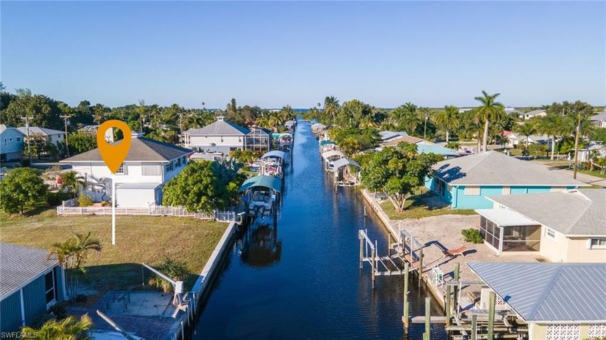 Large, 60' X 100' lot in Bokeelia with a NEW SEAWALL!  This property is ready for your new home or you can add a dock/lift and start enjoying the waterfront lifestyle today.  Direct access with NO BRIDGES allows you some of the fastest access you will find anywhere in South Florida.  Enjoy a quick boat ride to Cayo Costa, Boca Grande, Upper Captiva or any number of fishing spots to catch dinner at.  The boat ramp is a few hundred feet away for easy launching when you need it. Bokeelia living at a Great Price!