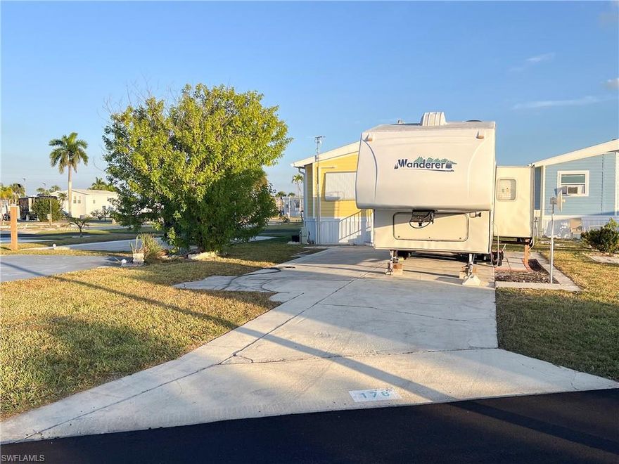 Enjoy the vibrant charm of Florida living— where year-around sunshine meets laid-back island vibes. Picture yourself basking in warm breezes, surrounded by lush landscapes, and living in harmony with the natural beauty of the tropics. Palmetto Palms RV is a 55+ Condo HOA where you OWN THE LAND! Electric, water and Sewer are RV ready or place a new manufactured home on this 37x37x57x57’ lot! Lot concrete is smooth and leveled. Desirable location, close to the community pool, clubhouse and Tennis Courts! Enjoy a carefree coastal lifestyle close to FMB and Sanibel. This area has so much to explore. Palmetto Palms offers boat storage and is biking or walking distance to Bunche Beach. No Pets. RV for purchase separately.